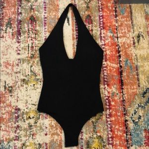 Black halter bodysuit.